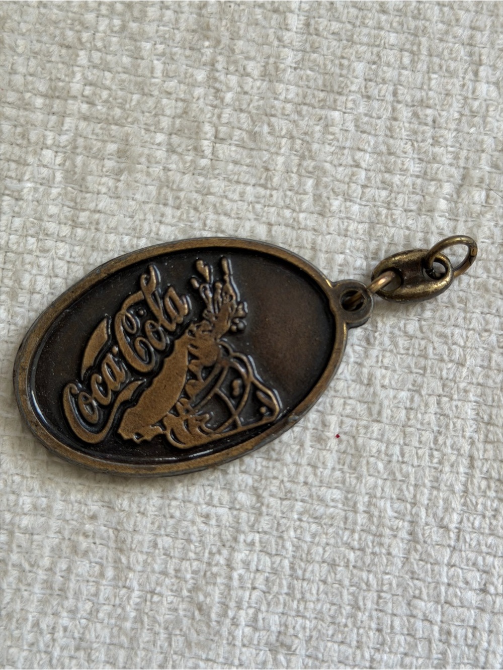 Vintage brass or bronze Coca-Cola promotional keyring or pendant